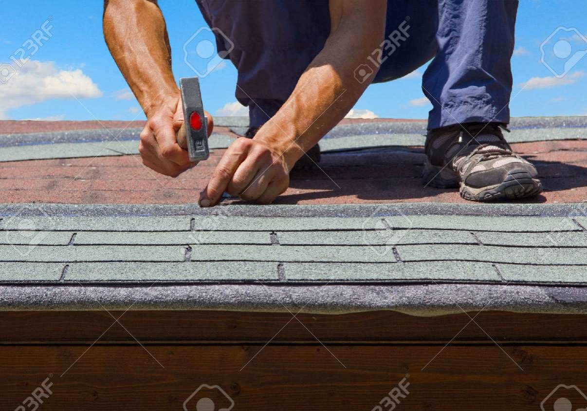43320098-gardener-renew-roof-of-summer-garden-house-with-tar-paper-shingles